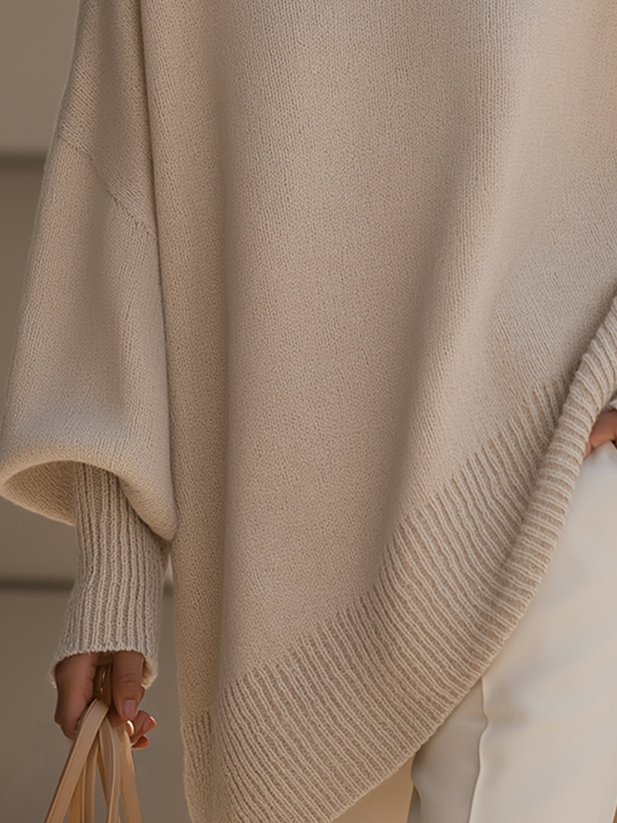 Oversized poncho sweater with ribbed hem and cuffs, light beige