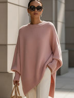 Oversized poncho sweater with ribbed crew neckline, soft pink