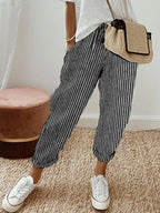 Women’s anti-sweat pants in black pinstripe, cuffed ankle, drawstring waistband