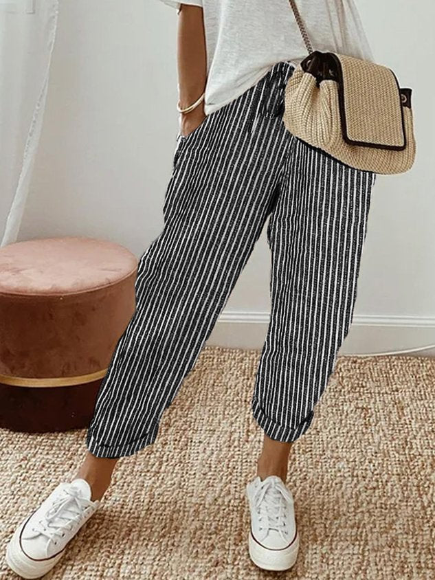 Women’s anti-sweat pants in black pinstripe, cuffed ankle, drawstring waistband