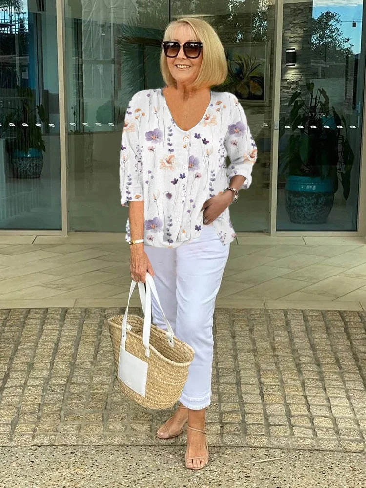 Women's three-quarter sleeve blouse, white with multicolor floral print and V-neck