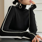 Black turtleneck sweater with contrasting white trim and long sleeves