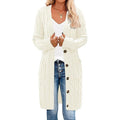 Off-white long knitted vest with button-front, cable texture, and side pockets.