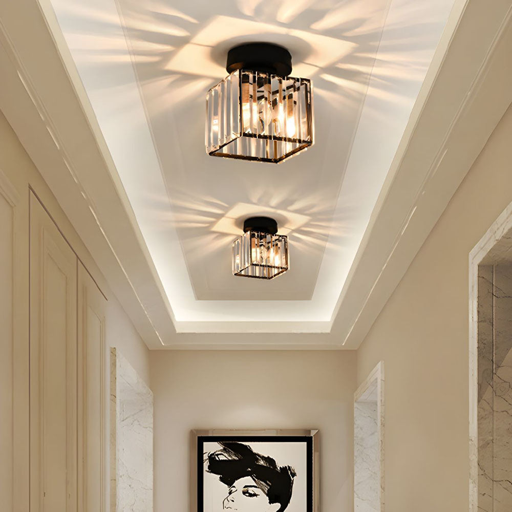Black crystal flush mount ceiling lamp with clear prism sides and warm bulbs