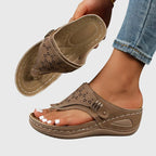 Women's wedge sandals in tan, perforated slide with adjustable buckle strap