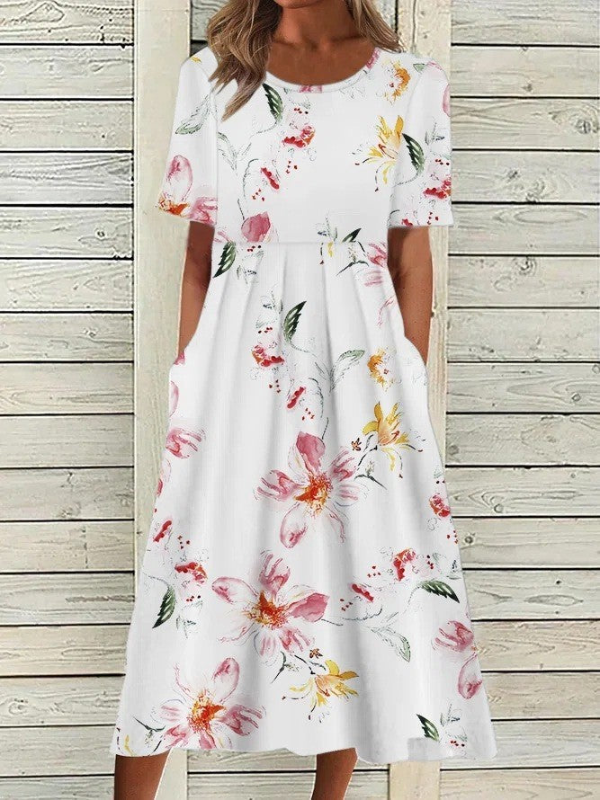 White floral midi dress with short sleeves and gathered skirt, allover bloom print