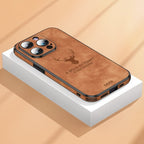 Deer leather iPhone case in brown with camera cutouts, deer emblem, and port openings.