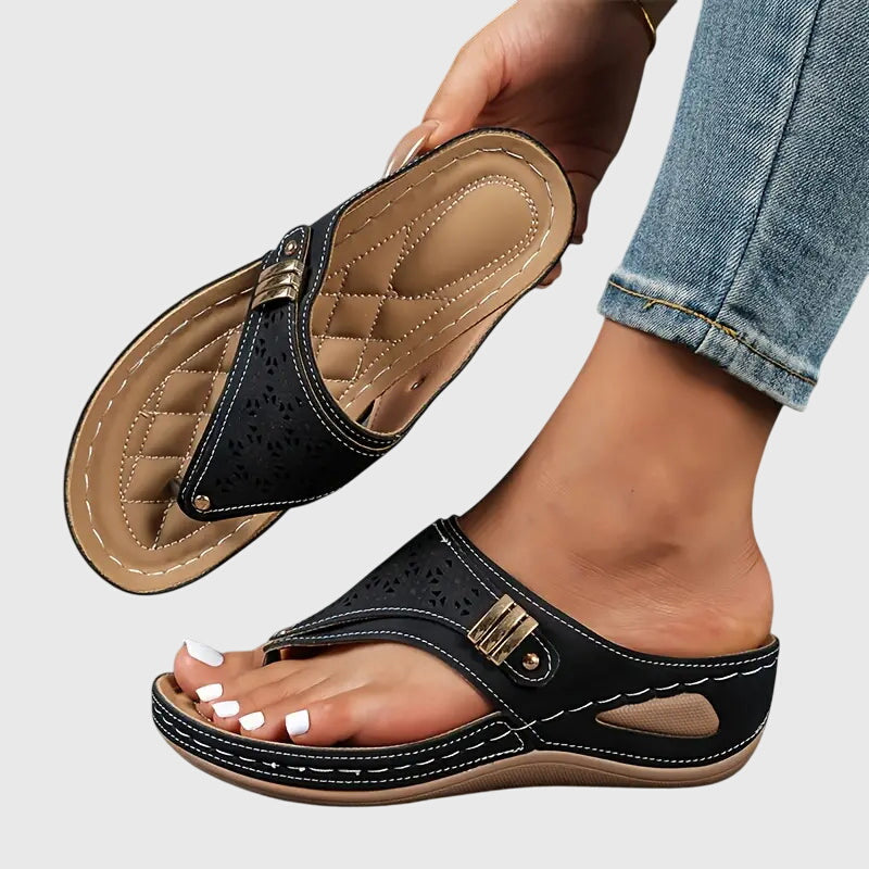 Women's wedge sandals in black, perforated slide with adjustable buckle strap
