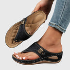 Women's wedge sandals in black, perforated slide with adjustable buckle strap