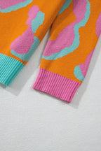 Women’s colorblock leopard print sweater, orange with teal and pink ribbed cuffs