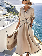 Beige maxi summer dress with V-neck twist-front knot and black trim