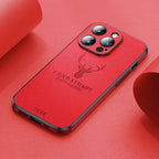 Deer leather iPhone case in red with camera cutouts and deer emblem, showing ports.