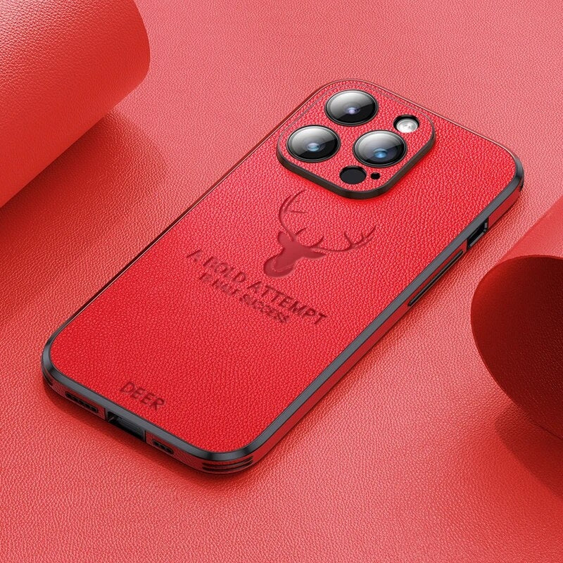 Deer leather iPhone case in red with camera cutouts and deer emblem, showing ports.