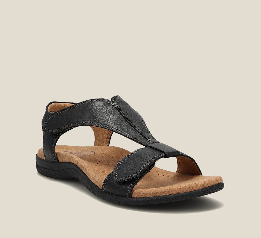 Black comfort sandals with adjustable cross strap and cushioned footbed