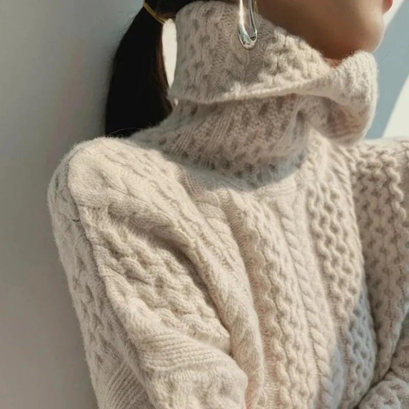 Beige cashmere cable turtleneck sweater with folded collar and braided knit sleeves