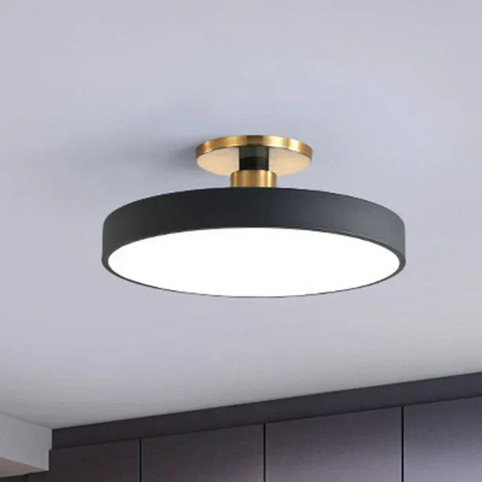 Round flush-mount LED ceiling lamp, black shade with gold mounting base and white light