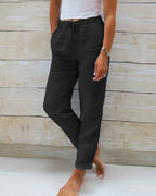 Black relaxed drawstring casual pants with pockets and ankle cuffs