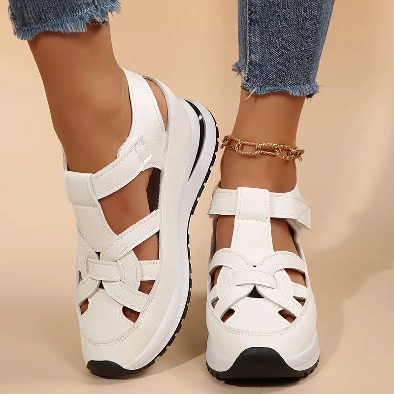 White platform sandals with ankle strap and cross upper, rear view