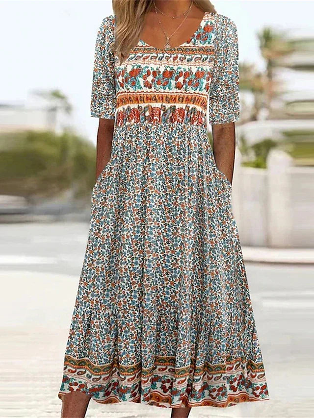 Boho print midi dress with short sleeves, square yoke, and tiered skirt hem detail