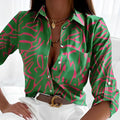 Green abstract print button-up blouse with pink pattern, pointed collar, long sleeves
