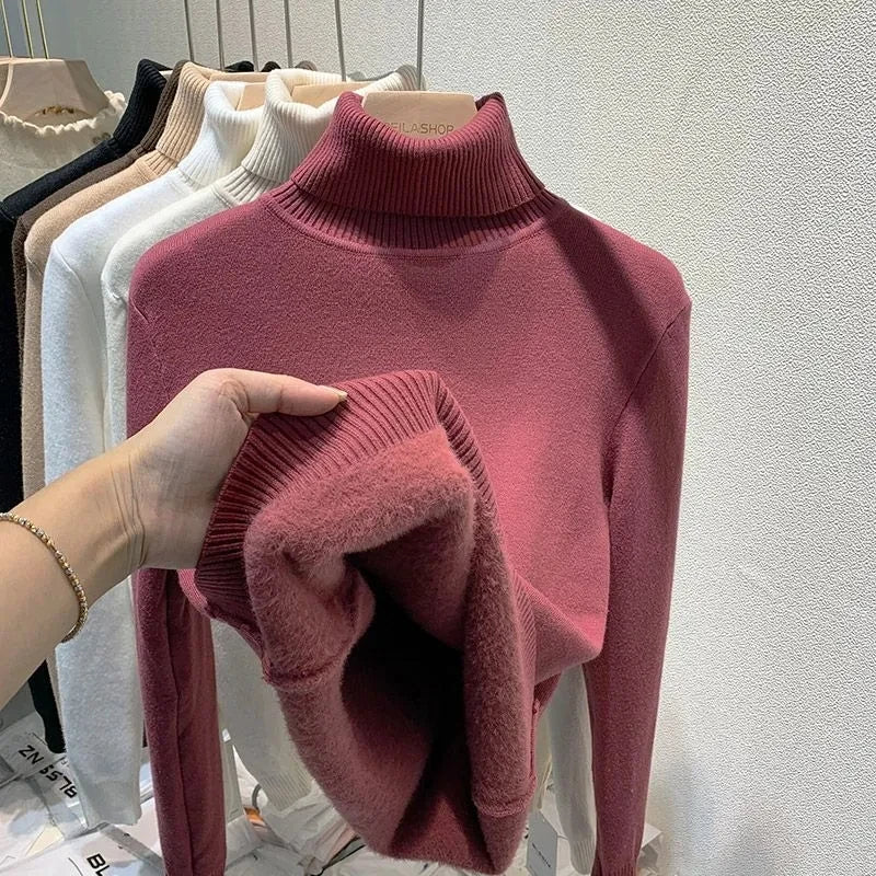 Mauve turtleneck velvet sweater with ribbed collar and soft fuzzy sleeve cuffs