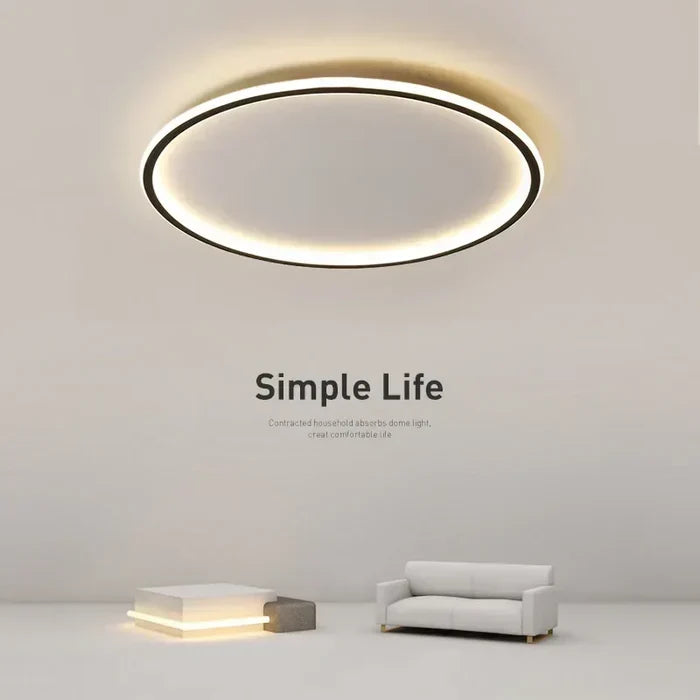 Round flush mount ceiling lamp with thin LED ring emitting warm white light