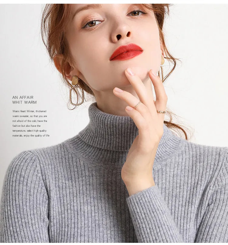 Gray ribbed turtleneck sweater with high collar and fitted long sleeves