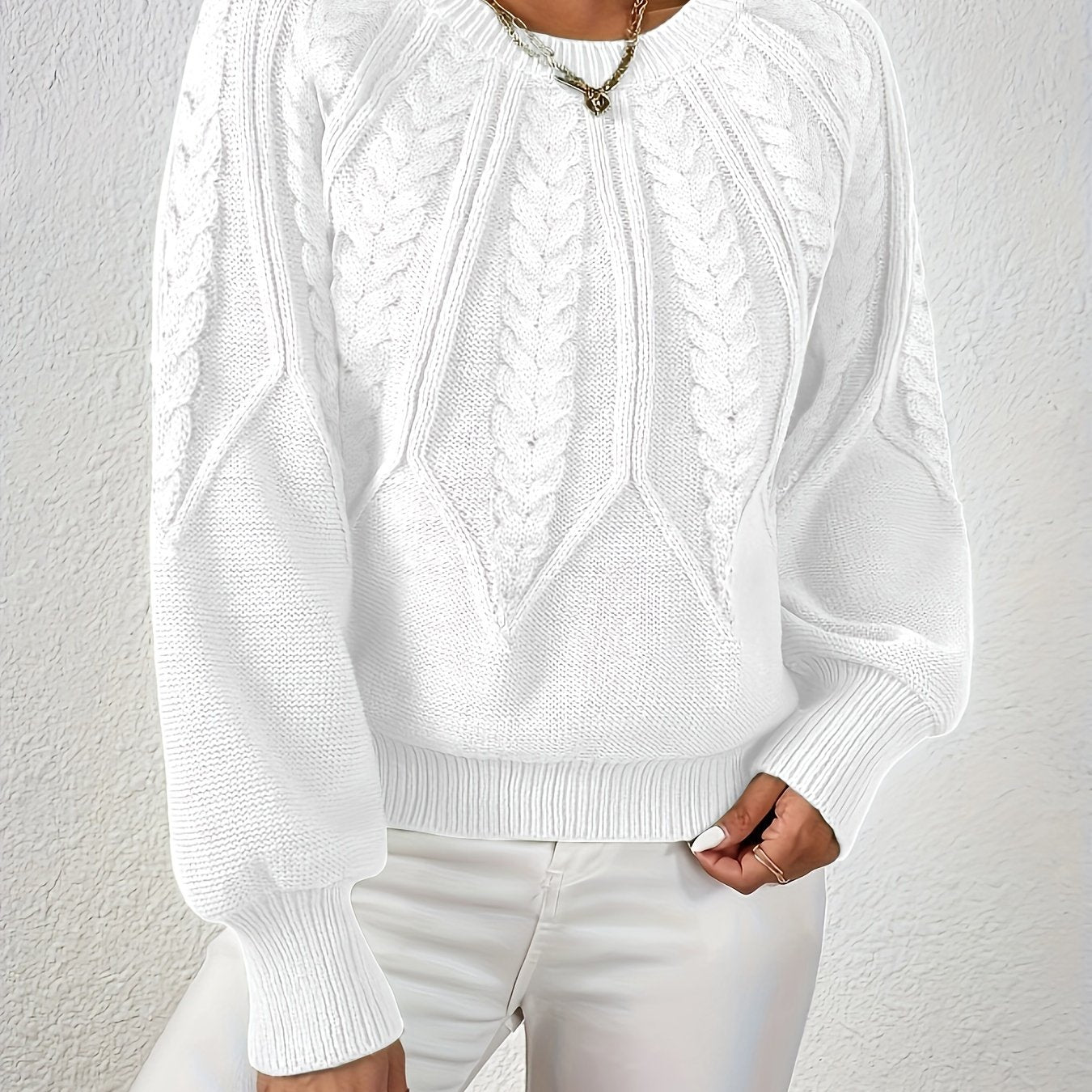 Women’s cable knit sweater with lantern sleeves, white, raised cable knit yoke.