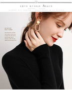 Black ribbed turtleneck sweater with high collar and long sleeves