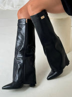 Black knee-high boots with wide flare top, block heel, side zip and buckle detail