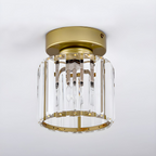 Gold crystal flush mount ceiling lamp with clear crystal shade and round brass rim
