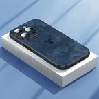Deer leather iPhone case in blue with camera cutouts and raised protective corners.