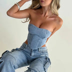 Light blue high-waist denim cargo jeans with utility pockets and stitched paneling.