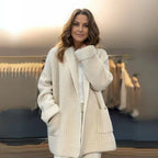 Women’s cream open-front knit cardigan worn with straight hem and patch pockets