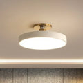 Round flush-mount LED ceiling lamp, white shade with gold base and bright glow
