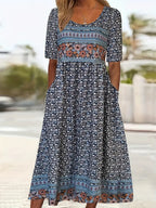Boho print midi dress with short sleeves and fitted bodice featuring panel patterns