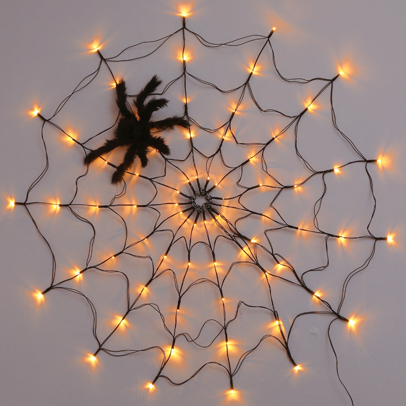 Spidweb-style Halloween LED lights with warm bulbs and black spider decoration