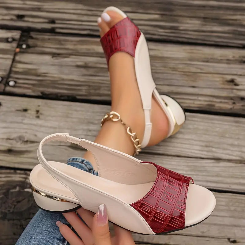 Red open-toe wedge sandals with cream upper and ankle strap detail