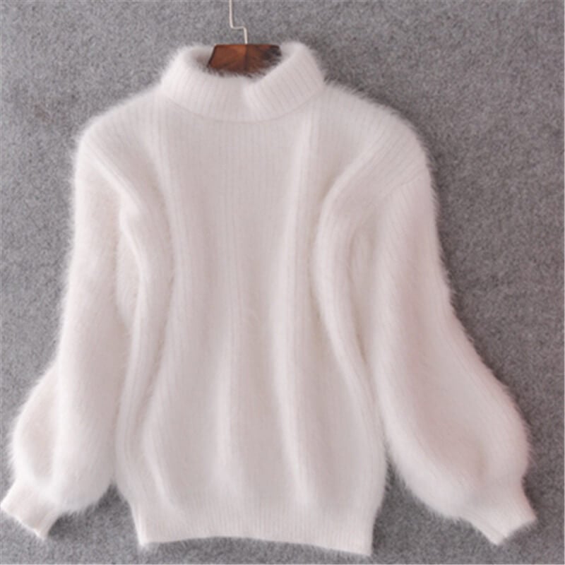 White loose knit wool sweater with high neck and long voluminous sleeves