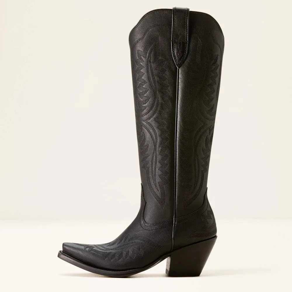 Black western cowboy boot with embossed embroidery, side pull tab, and stacked heel