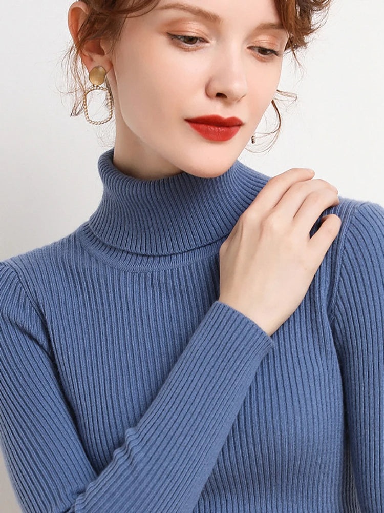 Blue ribbed turtleneck sweater with high collar and long sleeves
