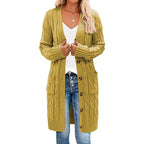 Mustard yellow long knitted vest with button-front and cable texture side pockets.