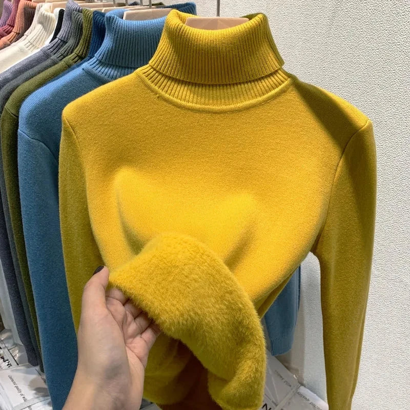 Yellow turtleneck velvet sweater with ribbed collar and fuzzy sleeve cuffs