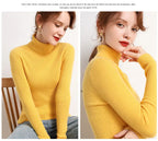 Yellow ribbed turtleneck sweater with long sleeves and fitted neckline