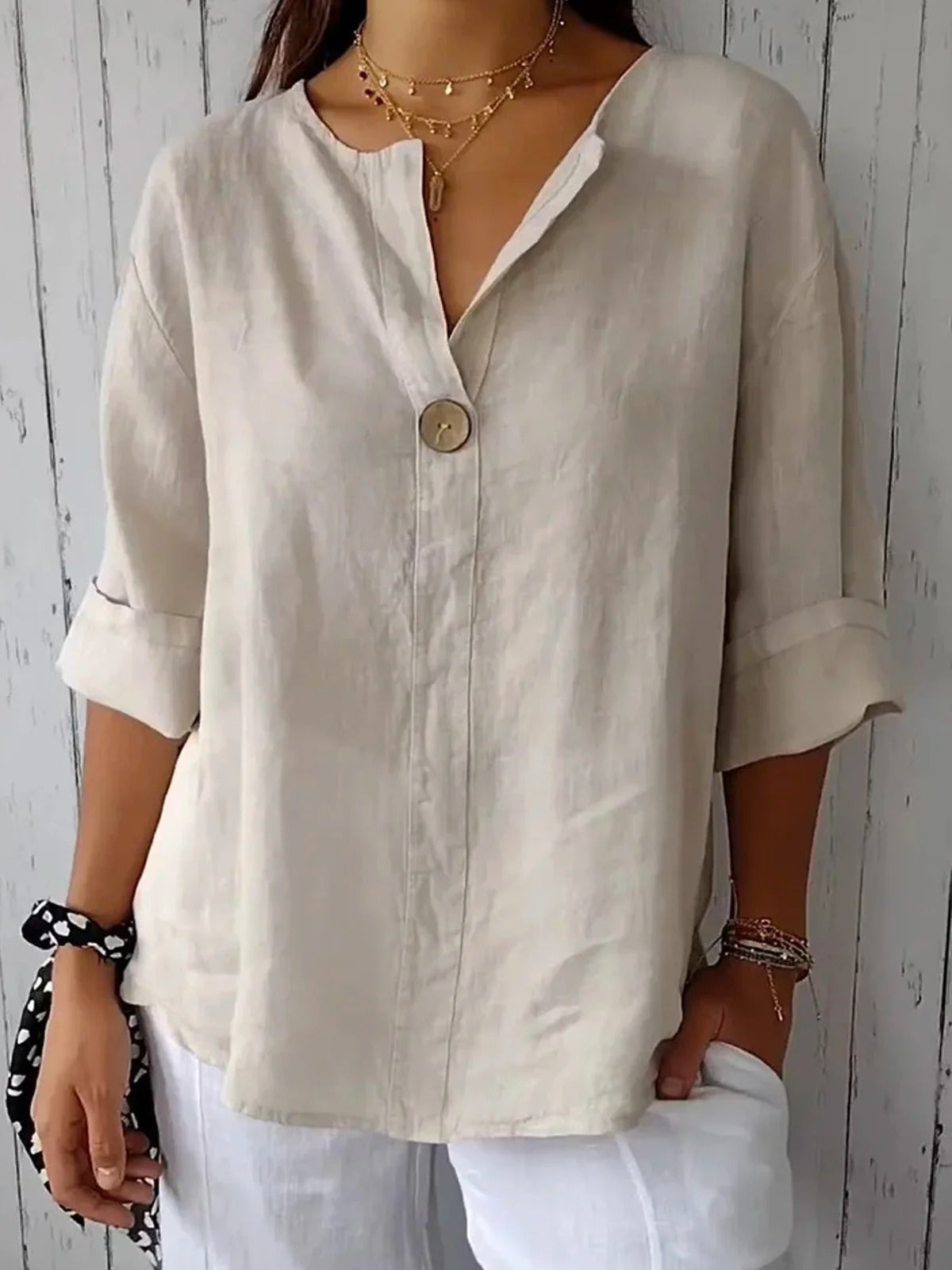 Ivory cotton loose-fit blouse, 3/4 sleeves, single-button V-neck placket