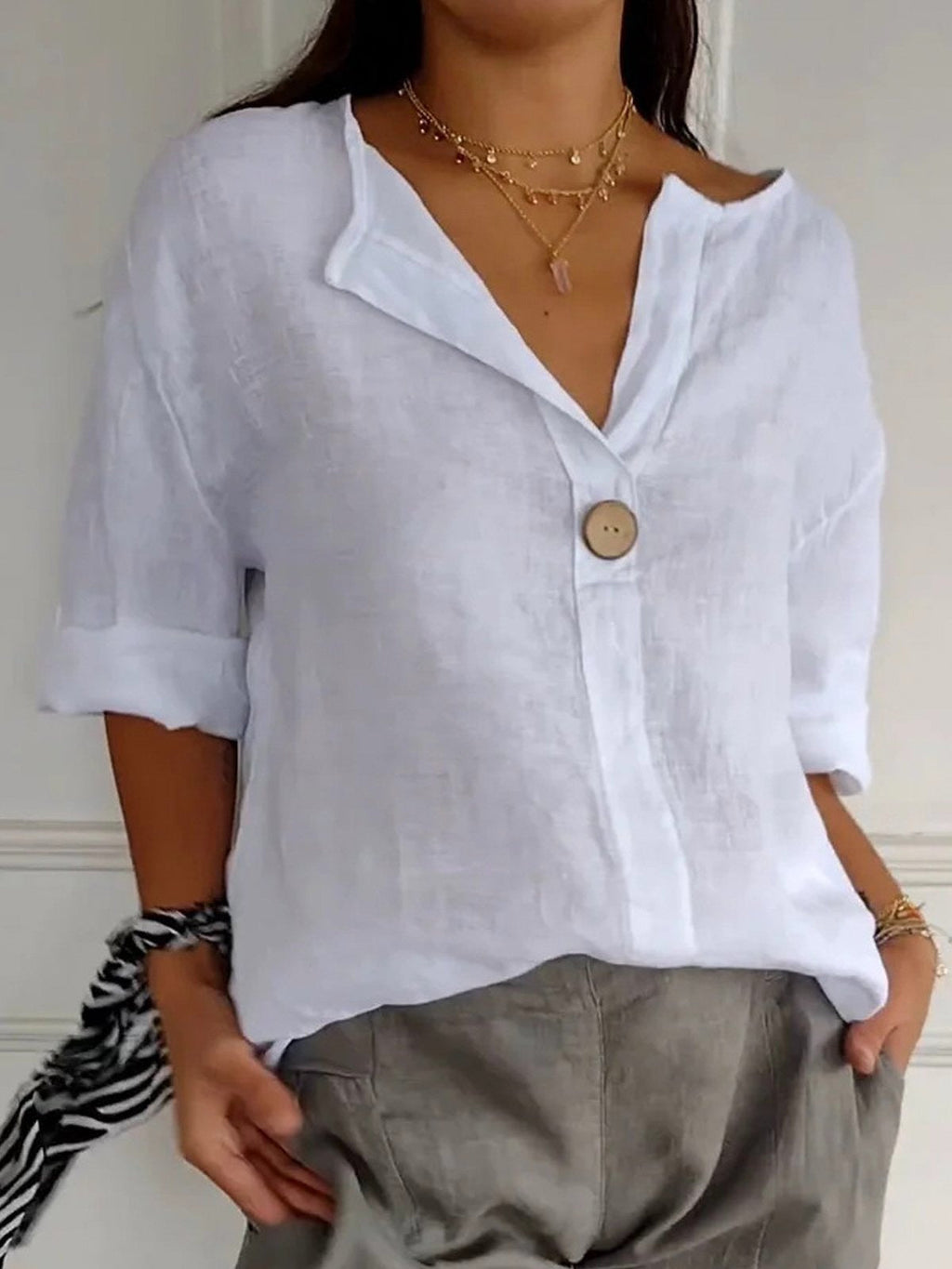 White cotton loose-fit blouse, 3/4 sleeves, single-button V-neck placket