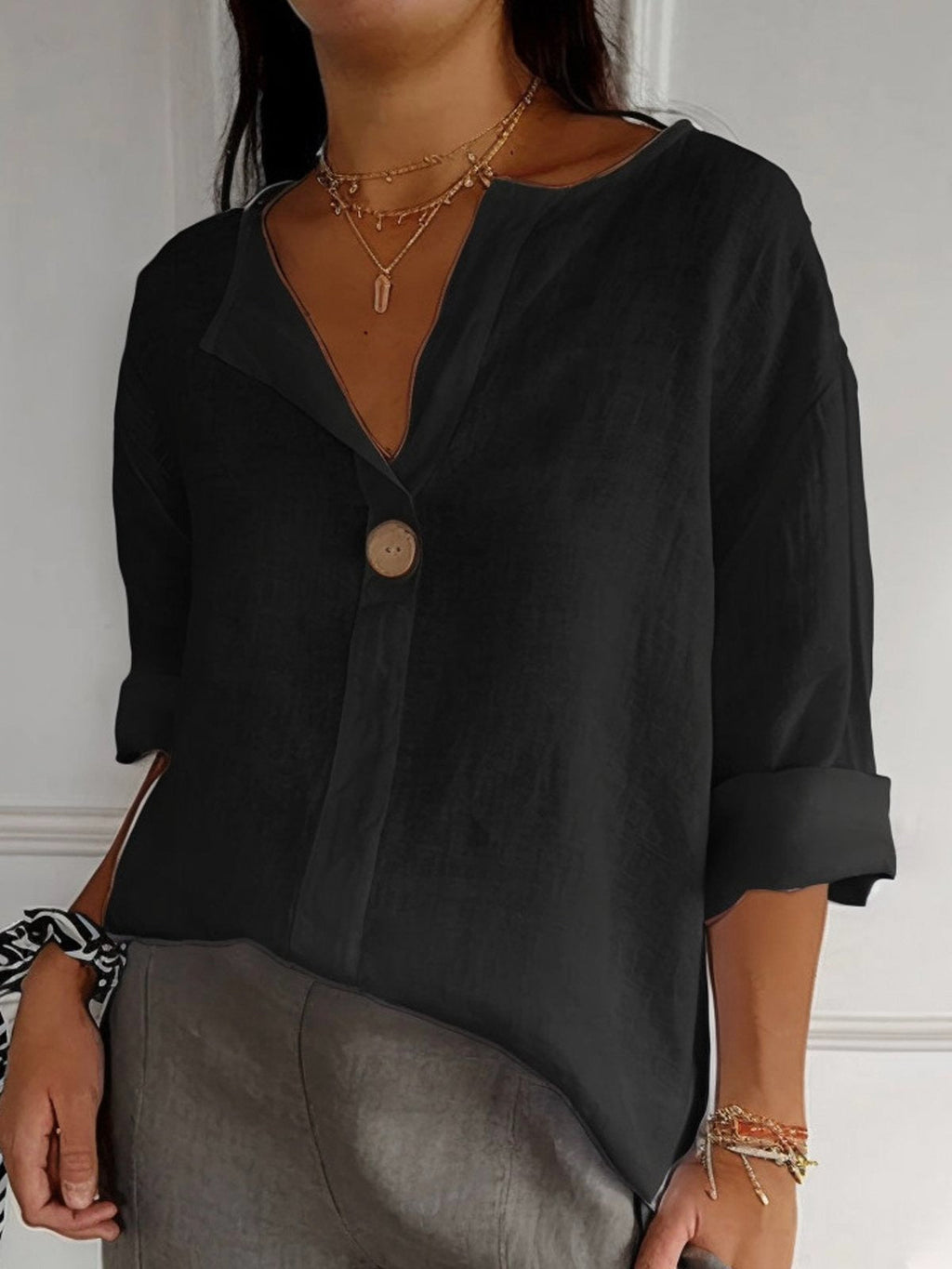 Black cotton loose-fit blouse, 3/4 sleeves, single-button V-neck placket