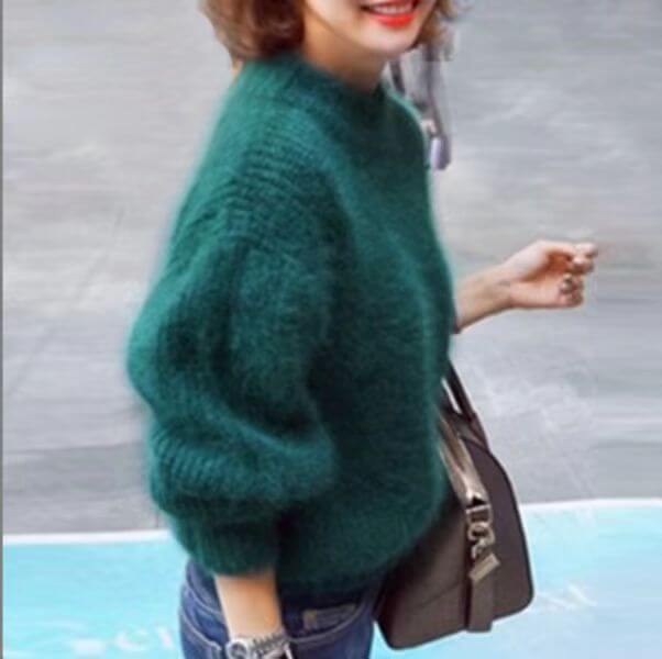 Dark teal loose knit wool sweater with high neck and long wide sleeves