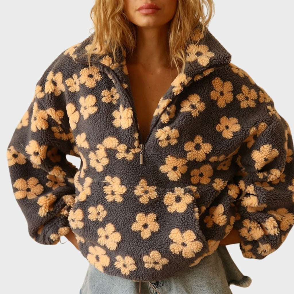 Women’s dark fuzzy quarter-zip sweater with large yellow floral print and zip-front