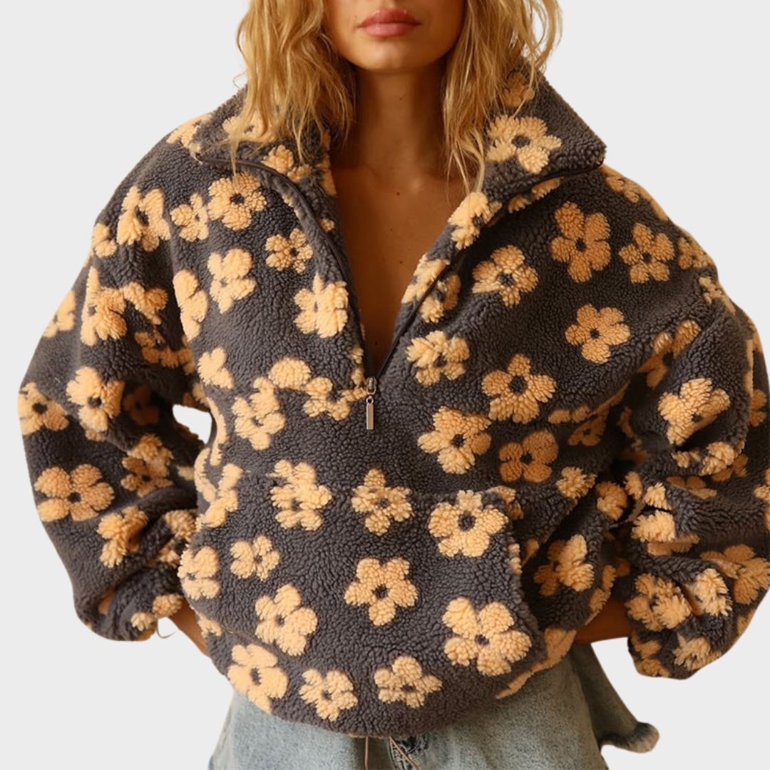 Women’s dark fuzzy quarter-zip sweater with large yellow floral print and zip-front